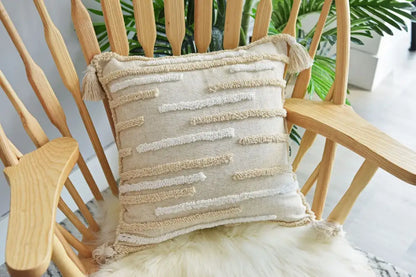 Beige textured throw pillow cover set with cream woven stripes and tassels for boho bedroom decor