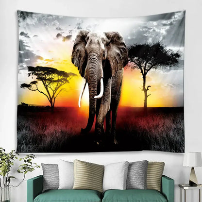 A decorbites boho elephant mandala tapestry featuring a grayscale elephant with white tusks against an orange sunset backdrop