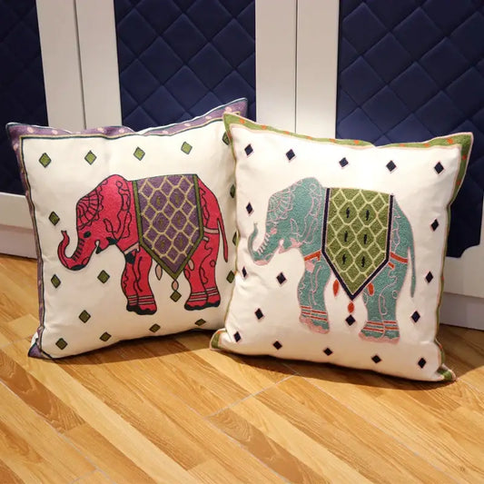 Two embroidered boho ethnic flower elephant throw pillowcases in pink and teal with white diamond accents for decorbites ethnic flower decor