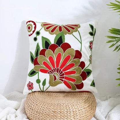 White pillow cover with vibrant red and gold embroidered floral patterns and green leaves for decorbites boho farmhouse floral decor
