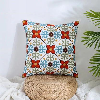 Square cream pillow covers with vibrant embroidered red and blue flowers decorbites boho farmhouse floral design