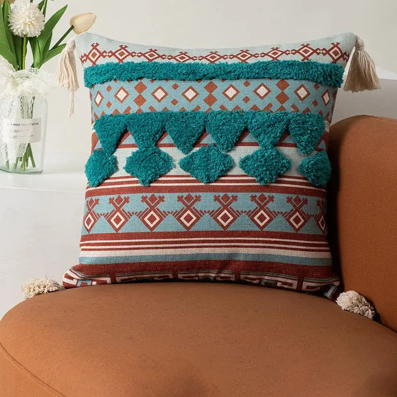 Teal and rust-colored woven boho fringe pillow cover with textured tassels for decorbites boho fringe pillow decor