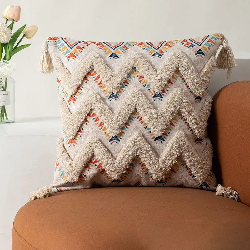 Beige woven boho fringe pillow cover with zigzag textured fringe and colorful geometric patterns for living room decor