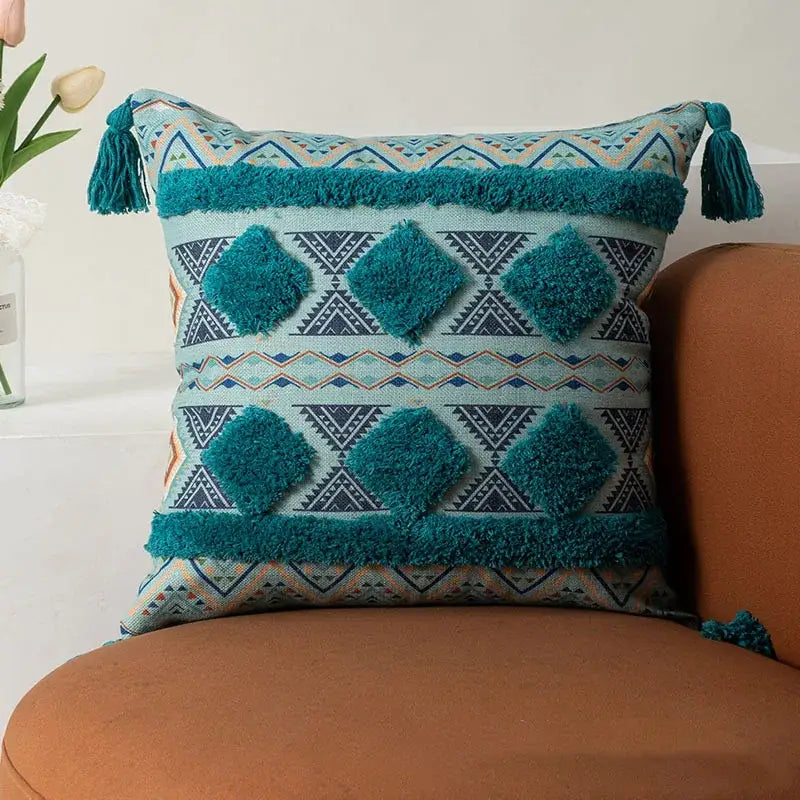 Teal and beige geometric patterned boho fringe pillow cover with fluffy tassels for decorbites boho fringe decorbites pillow covers