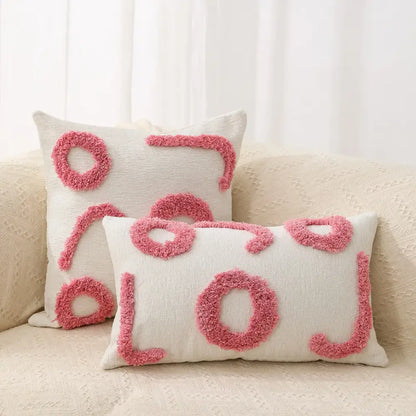 Cream-colored rectangular throw pillow with pink fuzzy lol lettering and matching square pillow in decorbites geometric chenille embroidered pillow covers set