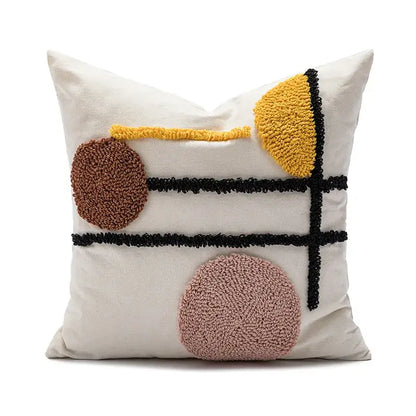 Cream-colored cushion cover with decorbites geometric embroidery in brown yellow and pink for boho living room decor
