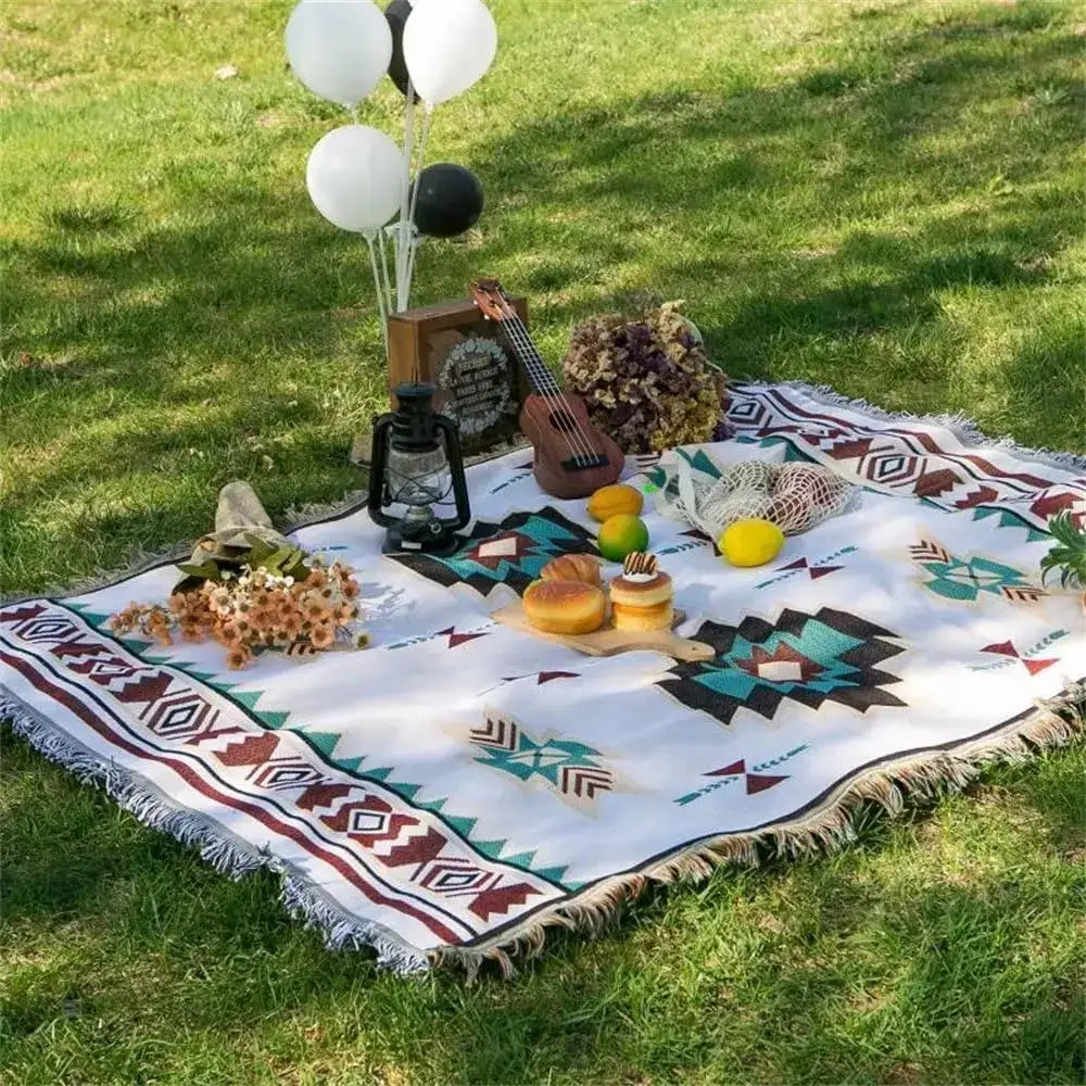 White woven throw blanket with teal brown black geometric patterns and fringed edges decorbites boho chenille woven