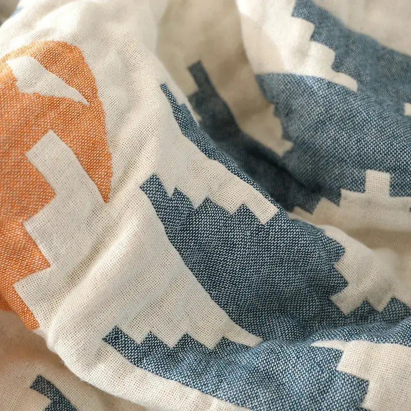 Boho cotton throw blanket with bold orange and navy blue geometric pattern on off-white cotton for sofa decorbites boho cotton