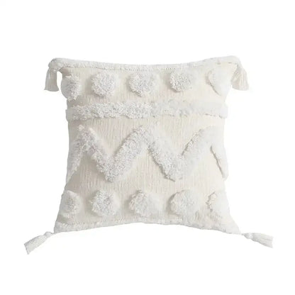 Cream-colored decorbites boho geometric tufted cushion cover with textured pom-poms and tassels for living room decor