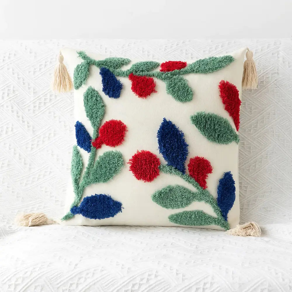 Cream-colored cushion cover with fluffy red and blue berry tufted embroidery and beige tassels for boho decorbites decor