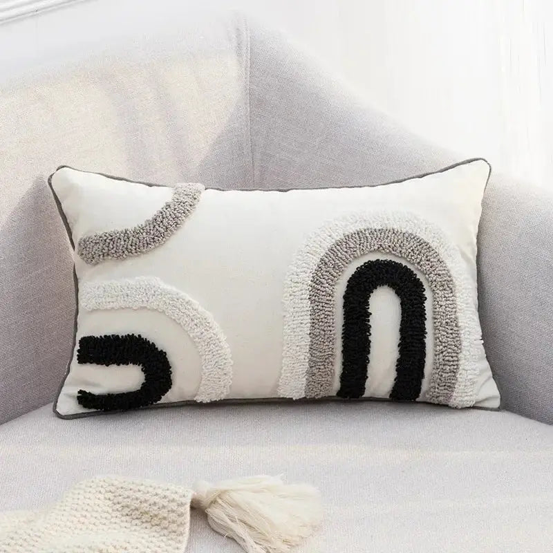 Rectangular white pillow cover with black and gray textured tufted rainbow design from decorbites geometric tufted set