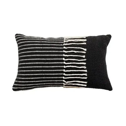 Black and white woven pillow cover with textured knit, vertical stripes, and tassels for boho geometric tufted decorbites set