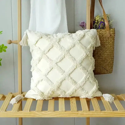 Cream-colored cushion cover with textured diamond pattern and fringed tassels decorbites geometric tufted pillow cover