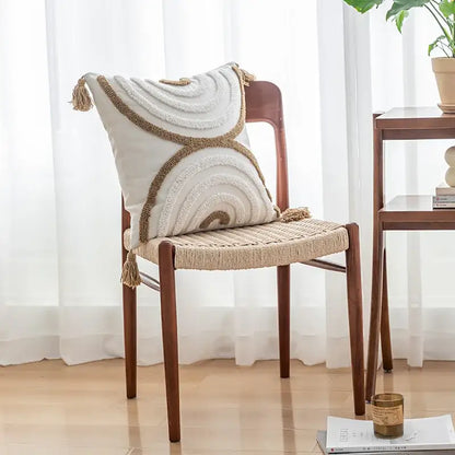 Cream-colored cream and beige decorbites geometric tufted pillow cover with concentric patterns and tassels for living room decor