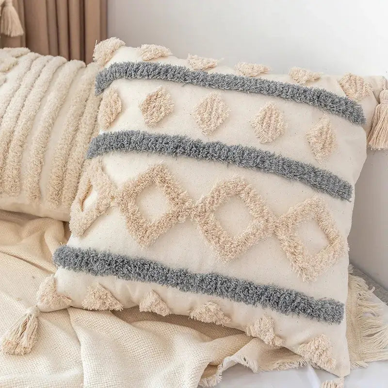 Cream-colored boho geometric tufted pillow cover with textured gray beige patterns and tassels for living room decorbites set of 4