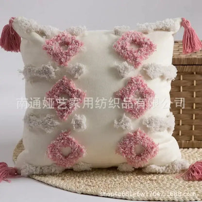 Cream-colored decorbites geometric tufted cushion cover with pink and white tassels for boho living room decor