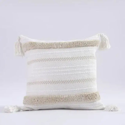 Boho morocco tufted cushion cover in white and beige with textured stripes and tassel decorbites boho morocco style