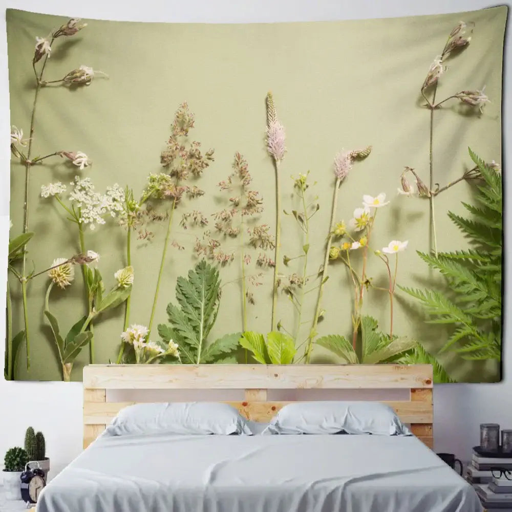A soft olive green wall tapestry with detailed botanical green leaf print for decorbites boho green leaf decor