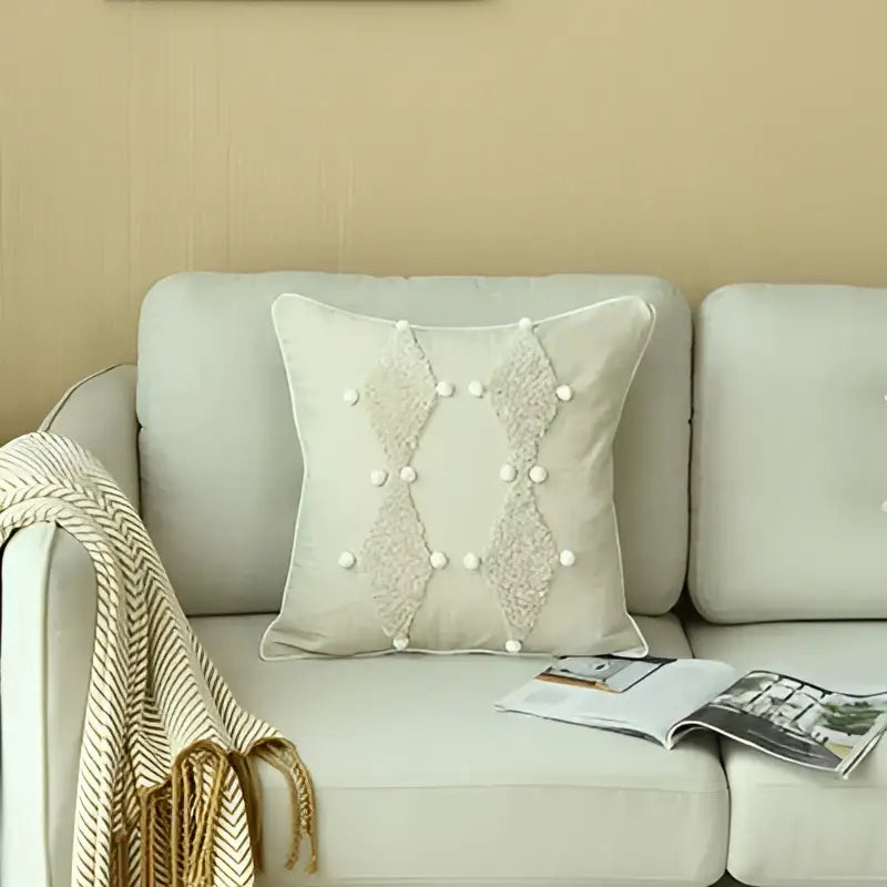 Beige boho ivory cushion cover with diamond embroidery and pearl embellishments featuring colorful pompoms decorbites ivory boho