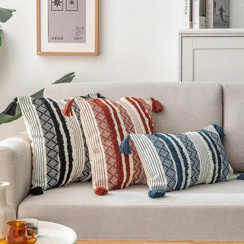 Three decorative throw pillows with woven geometric patterns and tassels featuring decorbites boho jacquard cushion covers