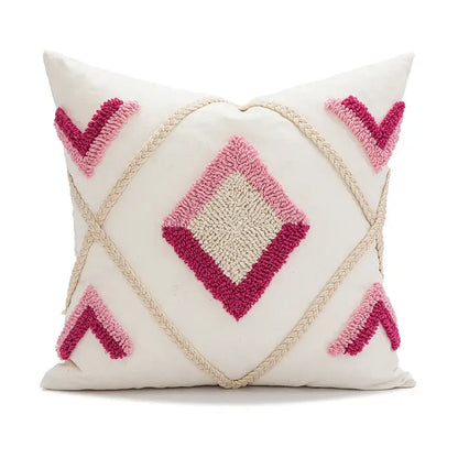 Cream-colored boho loop tufted pillow cover with pink and magenta geometric hooked yarn design for decorbites decor
