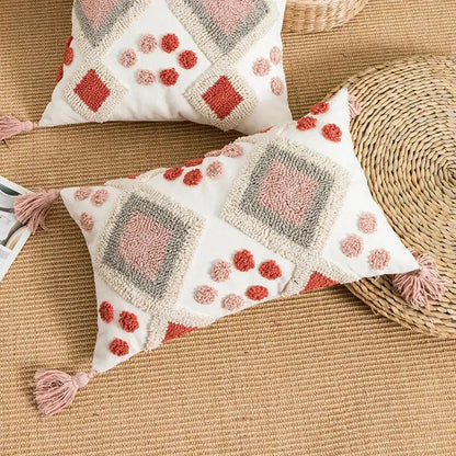 Cream-colored pillow cover with blush pink terracotta gray geometric patterns and tassels decorbites boho loop tufted design