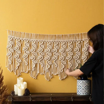 Beige boho macrame tapestry curtain with intricate cream leaf pattern and dangling fringe for bedroom decorbites decor