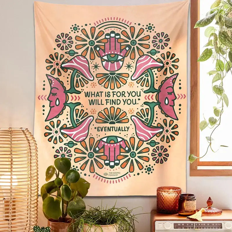 A peach-colored boho moon flower magic tapestry with symmetrical floral and hamsa designs for bedroom wall hanging