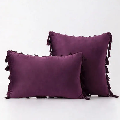 Deep purple velvet pillow covers with dark tassel fringe edges for elegant boho home decor living room accents