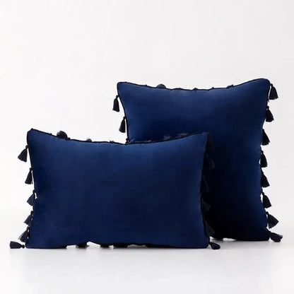 Deep navy velvet pillow covers with black tassel fringe edges perfect for boho home decor living room accents