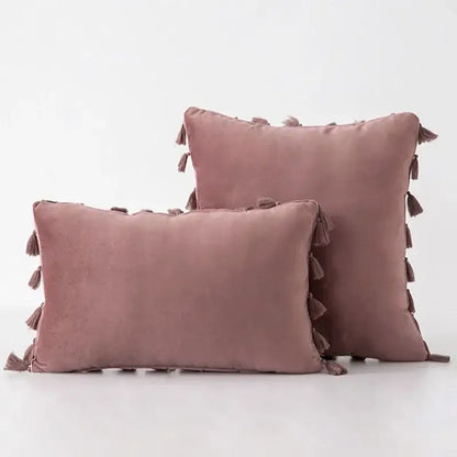 Pair of mauve velvet pillow covers with tassel fringe ideal for boho home decor and living room accents