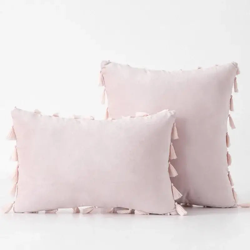 Soft blush pink velvet pillow covers with tassel fringe accents for boho living room home decor