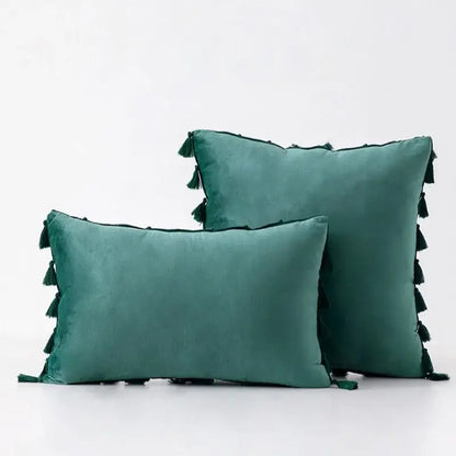 Teal velvet throw pillow covers with black tassel fringe for boho home decor living room accents