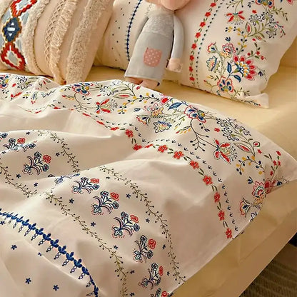 Cream-colored bedding set with decorbites boho pattern printed intricate red blue and green floral embroidery duvet cover