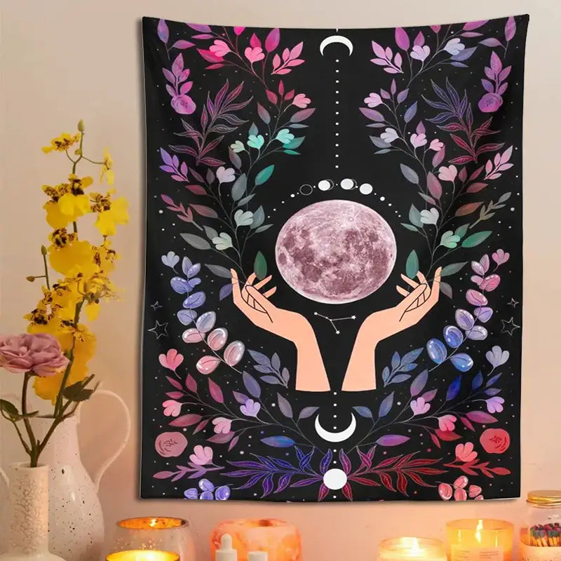 A vibrant black botanical moon tapestry featuring a pinkish-purple moon with floral and celestial wreaths for bedroom wall art