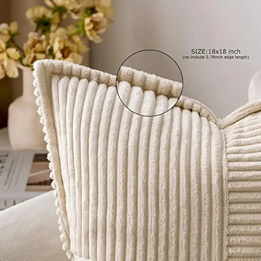Cream-colored corduroy boho striped pillow cover with textured ribbed surface and pom-pom trim for living room decorbites decor