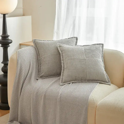 Gray corduroy boho striped pillow covers with patchwork design rest on beige sofa for decorbites boho striped decor