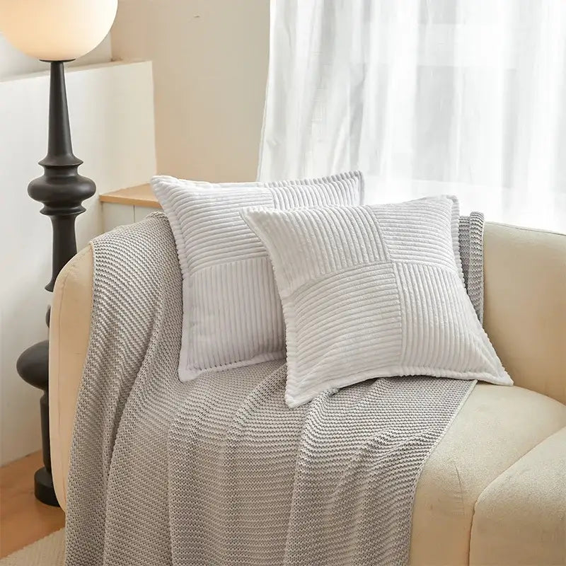Two off-white corduroy pillow covers with quilted ribbed texture on beige sofa decorbites boho striped pillow