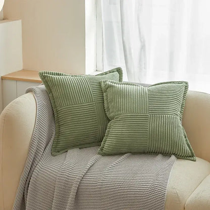 Two sage green corduroy boho striped pillow covers with quilted patchwork resting on beige sofa for living room decorbites boho striped pillow decor