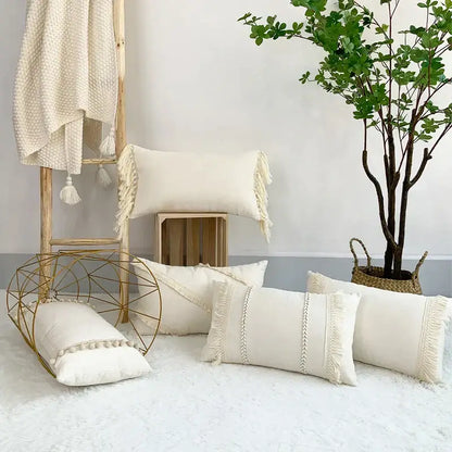 Cream-colored boho style linen cushion cover with fringed edges and woven patterns perfect for living room decorbites decor