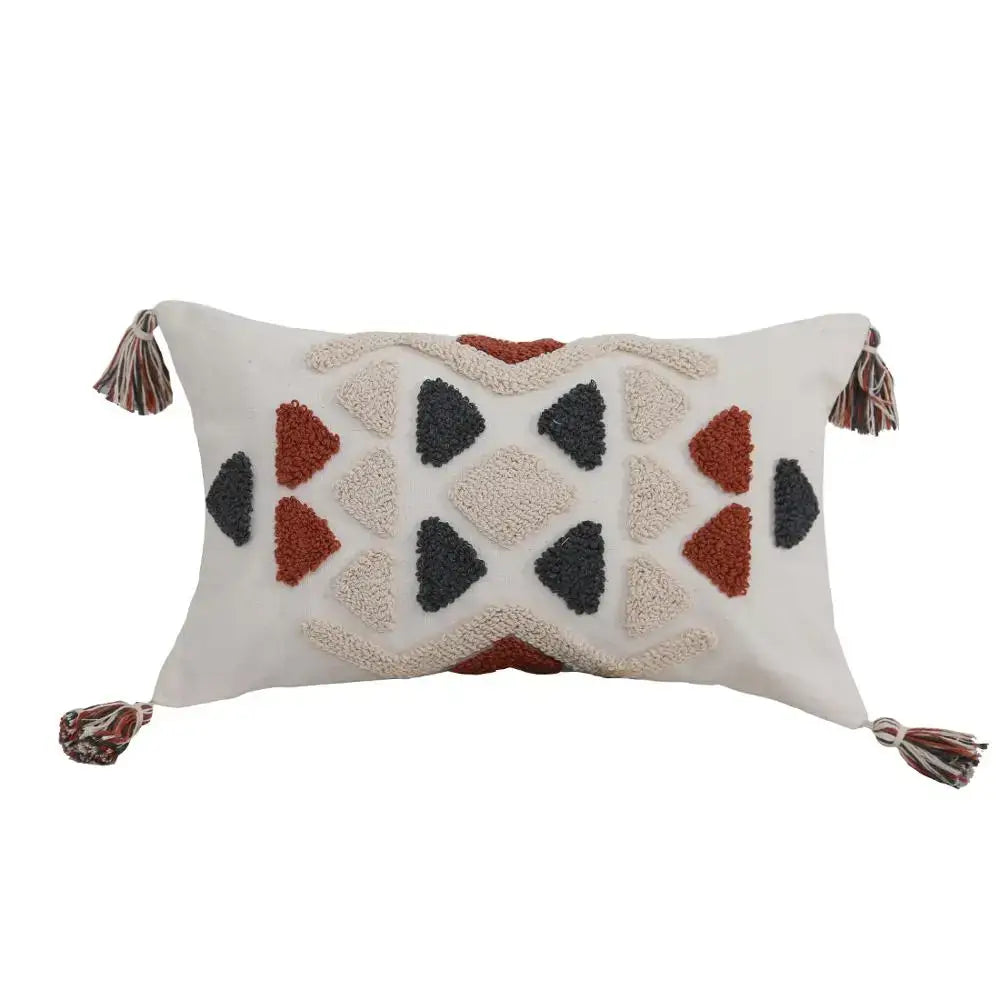 Cream pillow cover with textured rust and charcoal geometric pattern and multicolored tassels decorbites boho style embroidered