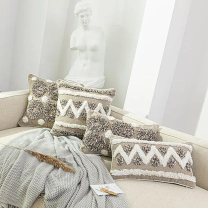 Beige textured throw pillows with white and gray fringe detail in decorbites boho style tufted cushion cover for living room
