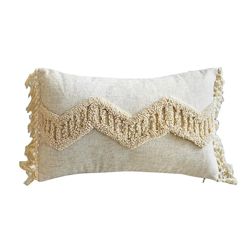 Cream-colored boho style tufted cotton cushion cover with textured wavy knit band and fringed edges for sofa decorbites