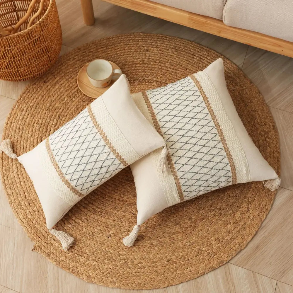 Cream-colored rectangular boho tassel cushion cover with beige gray geometric patterns and tassels by decorbites