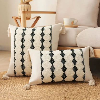 Cream-colored boho tassel cushion cover with black geometric embroidery and tassels by decorbites for living room decor