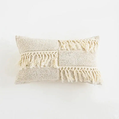 Beige boho tassel cushion cover with textured patchwork, fluffy tassels, and woven fringe for living room decorbites decor