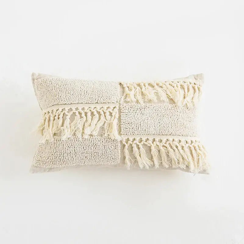 Beige boho tassel cushion cover with textured patchwork, fluffy tassels, and woven fringe for living room decorbites decor