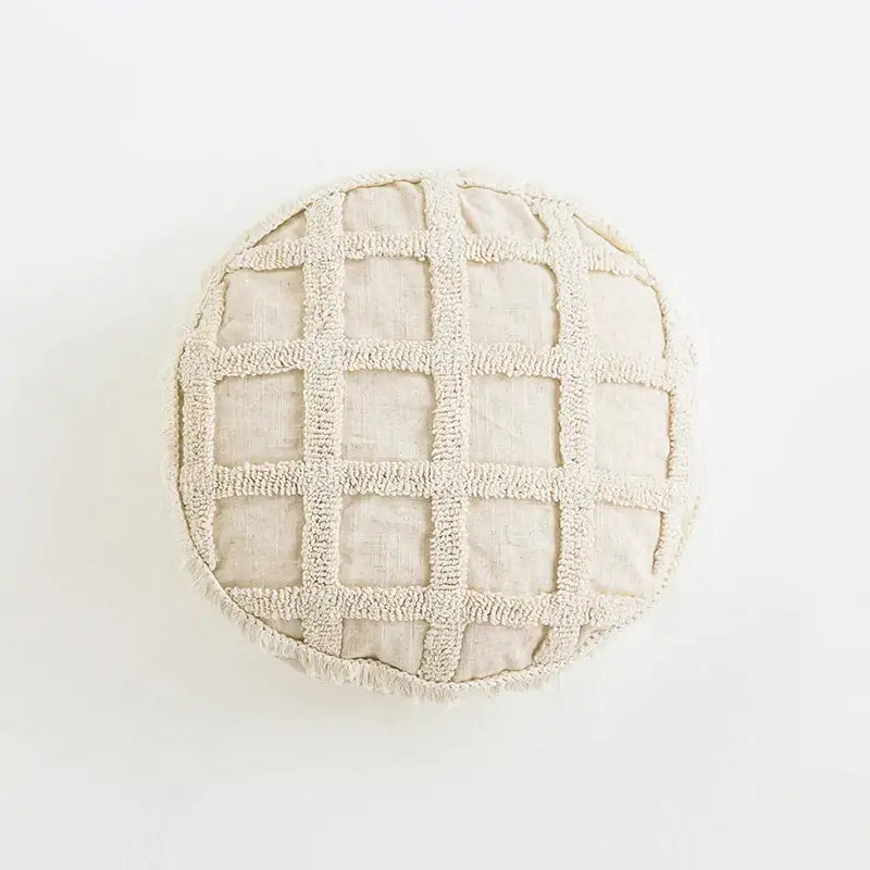 Beige round pouf with textured grid pattern made of soft frayed fabric boho tassel cushion decorbites cushion cover