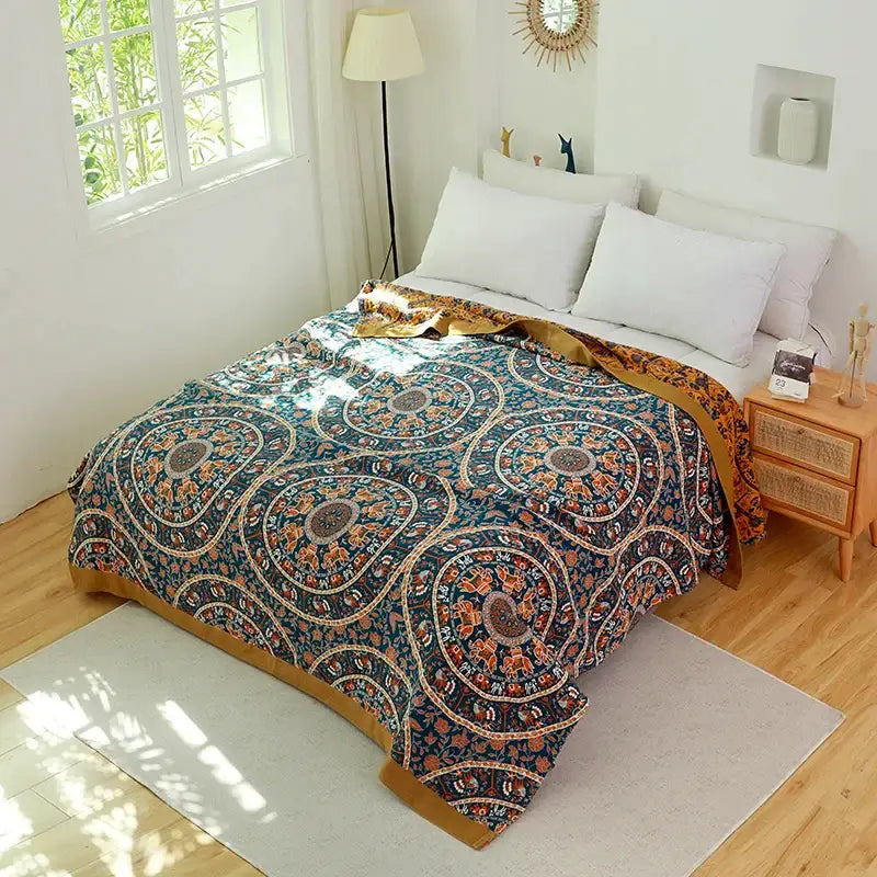 Boho teal and gold elephant cotton throw blanket featuring a teal and orange mandala-patterned bedspread with gold border decorbites cotton boho
