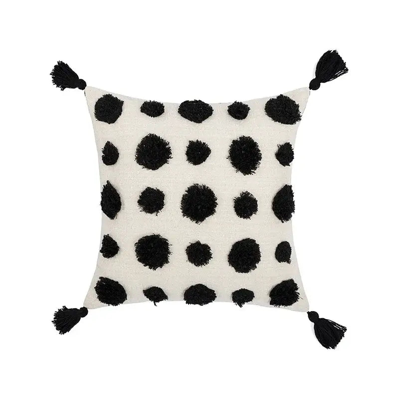 Off-white pillow cover with black textured pom-poms and tassels for decorbites boho tufted beige living room decor